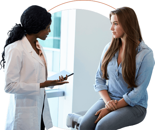 Doctor and patient sit talking