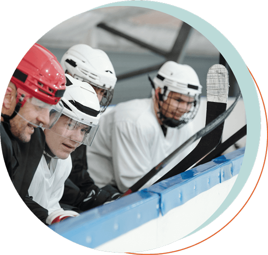 hockey team sitting at the sidelines